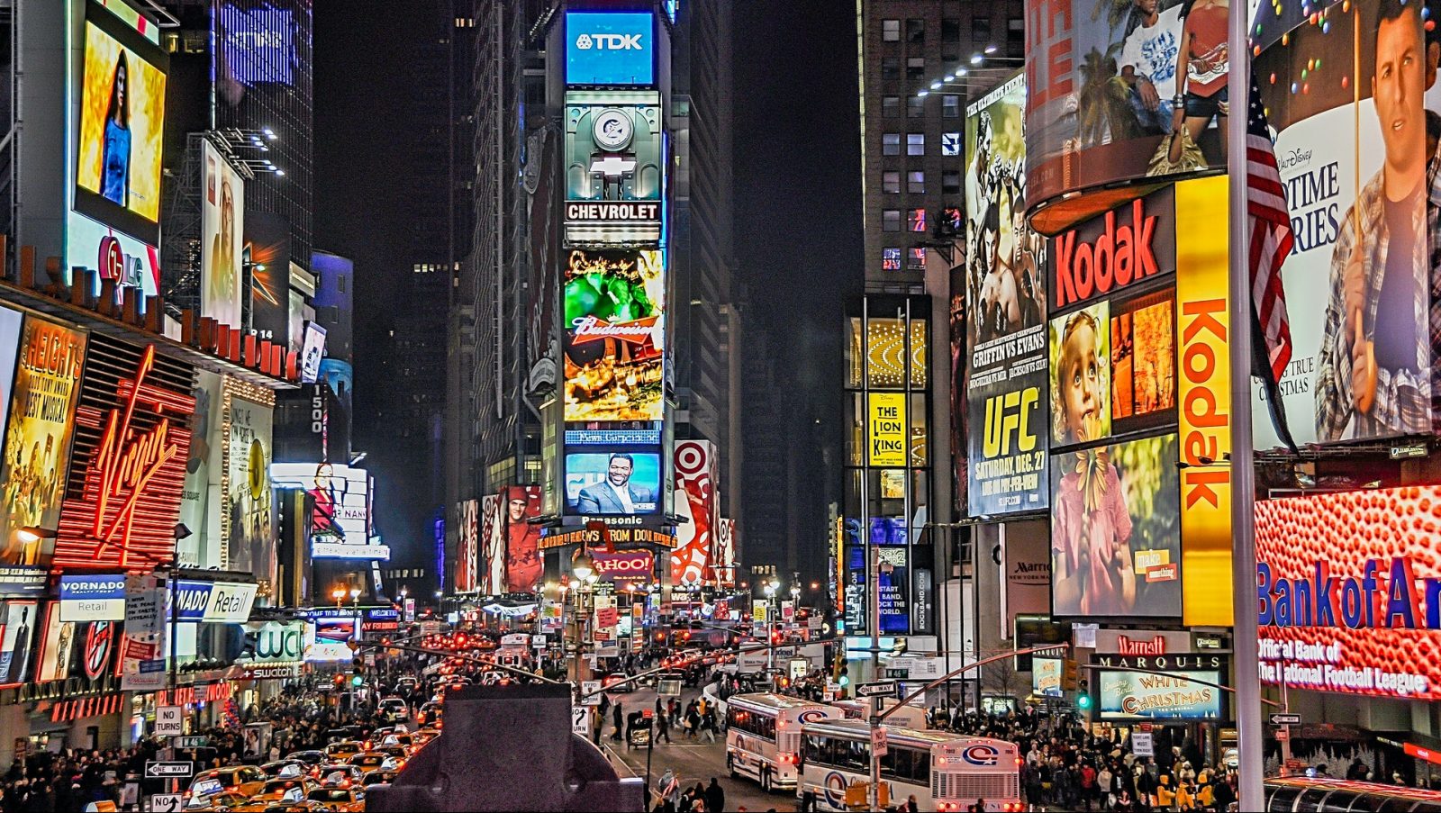 Bright and colorful lights shine from numerous billboards in Times Square into the night sky in New York, USA. Image: Pexels/Jose Francisco Fernandez Saura